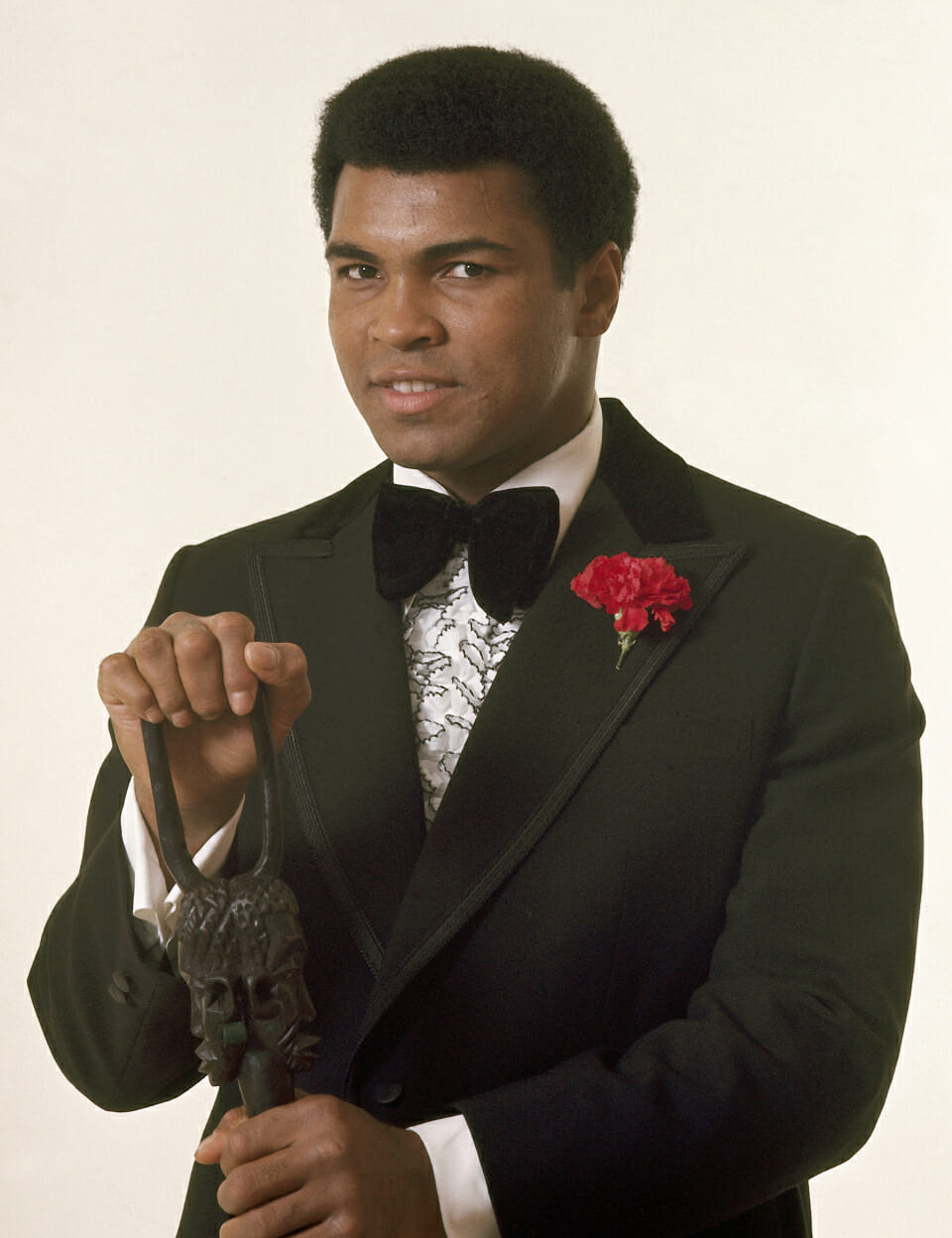 Portrait of Muhammad Ali wears a tuxedo during the Sportsman of the Year photo shoot at Playboy Studios. Chicago, Illinois 11/20/1974 (Image # 4033 )