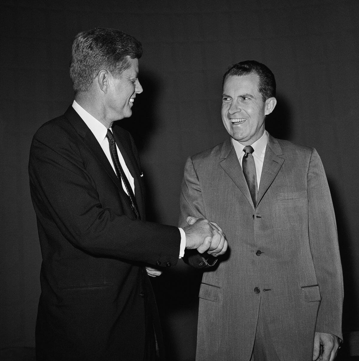 Presidential nominee Richard Nixon and Sen. John F. Kennedy shake hands, Sept. 26, 1960 in Chicago, as they hired television studio to take part in their debate. (AP Photo)